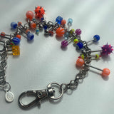 Pulsera colmada de piercings /tobillera